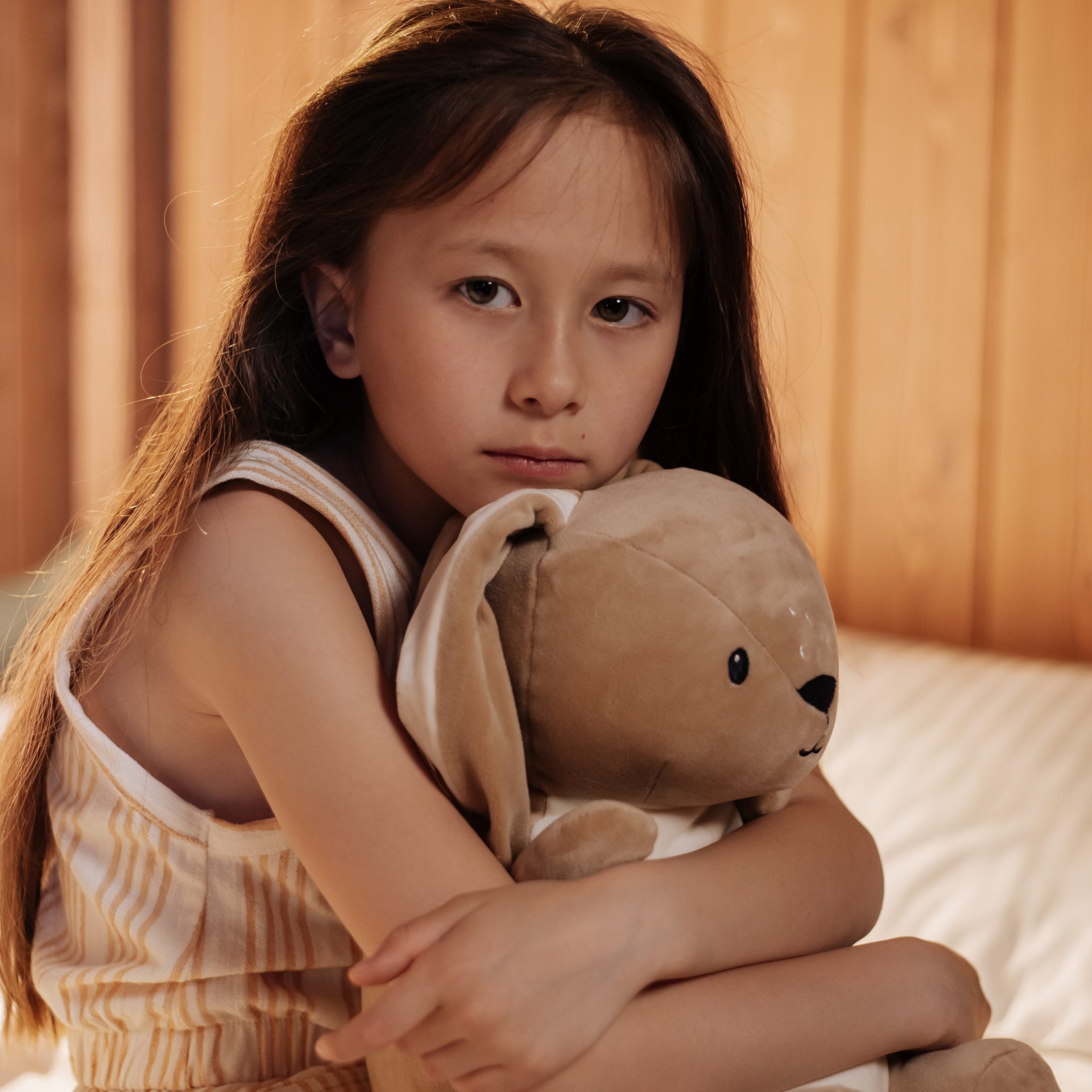 Little girl holding teddy bear